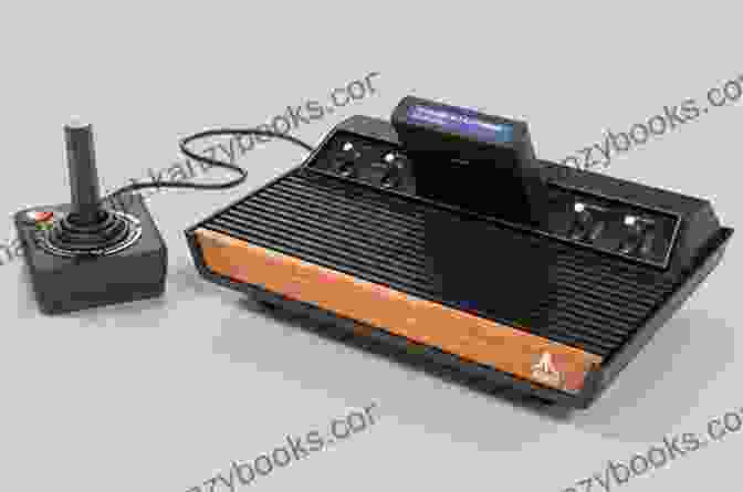 Atari 2600 Console And Game Cartridges On A Wooden Table The Game Console 2 0: A Photographic History From Atari To Xbox